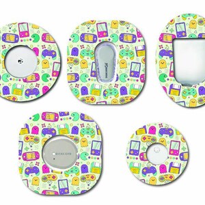 May include: Five adhesive patches with a light green background featuring a colorful pattern of retro video game consoles, controllers, floppy disks, and ghosts in shades of purple, pink, yellow, and teal, designed for medical sensor devices.