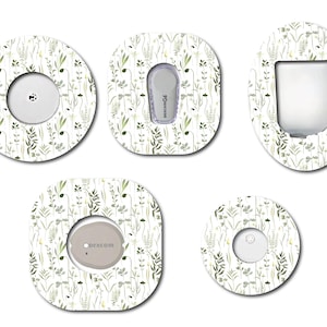 May include: Set of five white adhesive patches with a green and gray floral pattern. The patches are designed to cover medical devices like insulin pumps and continuous glucose monitors. The patches feature different shapes and sizes, including round, oval, and square.