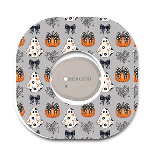 May include: A square adhesive patch with rounded corners featuring a gray background and a repeating Halloween pattern of orange pumpkins with black and white plaid bows, white ghosts with orange flowers, and black spiderwebs with small spiders.