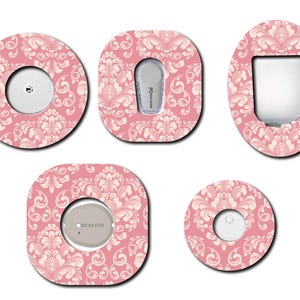 May include: Five different pink and white patterned adhesive covers for medical devices. The patterns feature a damask design. The covers are round, oval, and square.