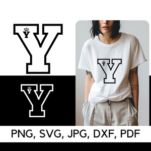 May include: A black and white graphic design of the letter Y with a crown on top. The letter is in a bold, blocky font. The design is on a white t-shirt.