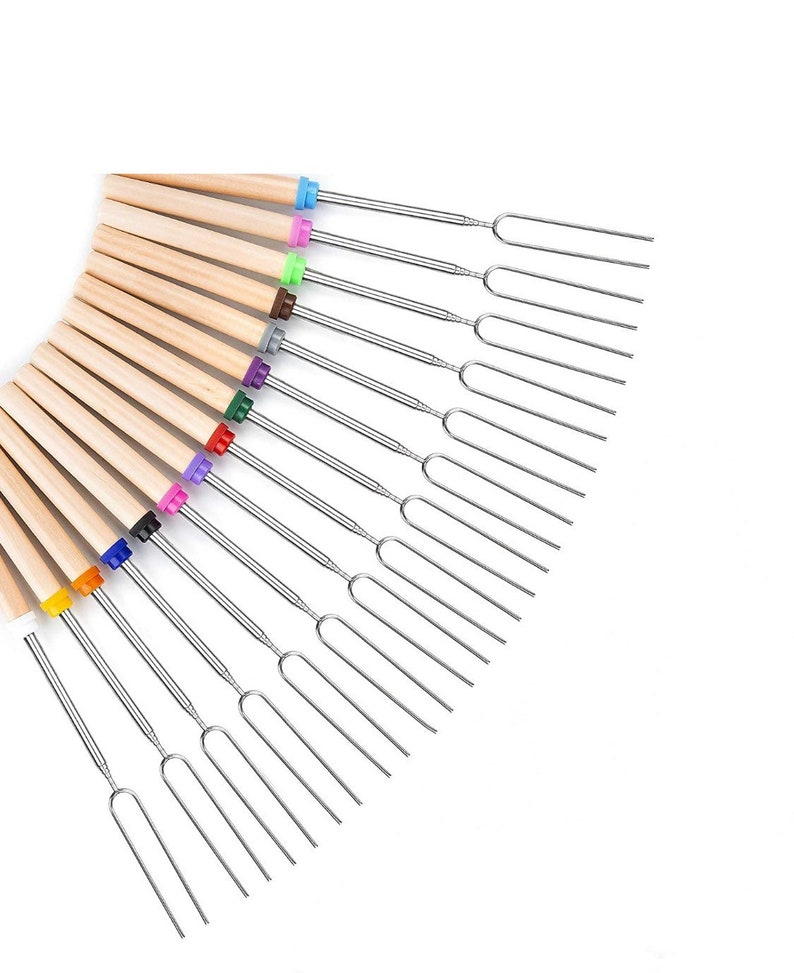 May include: A set of 12 colorful marshmallow roasting sticks with wooden handles and metal forks. The sticks are arranged in a fan shape, with the handles at the top and the forks at the bottom.