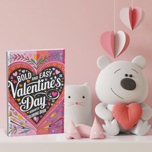 May include: A Valentine's Day romantic coloring book with a heart design and the text "Bold and Easy Valentine's Day". A white bear holds a red heart, and a white cat-shaped object is next to it. Pink heart decorations hang from above.