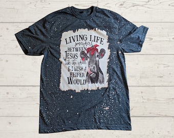 Living life somewhere between Jesus take the wheel and I wish a heifer would tee, Bleached t shirt, Woman T shirt,  Birthday gift
