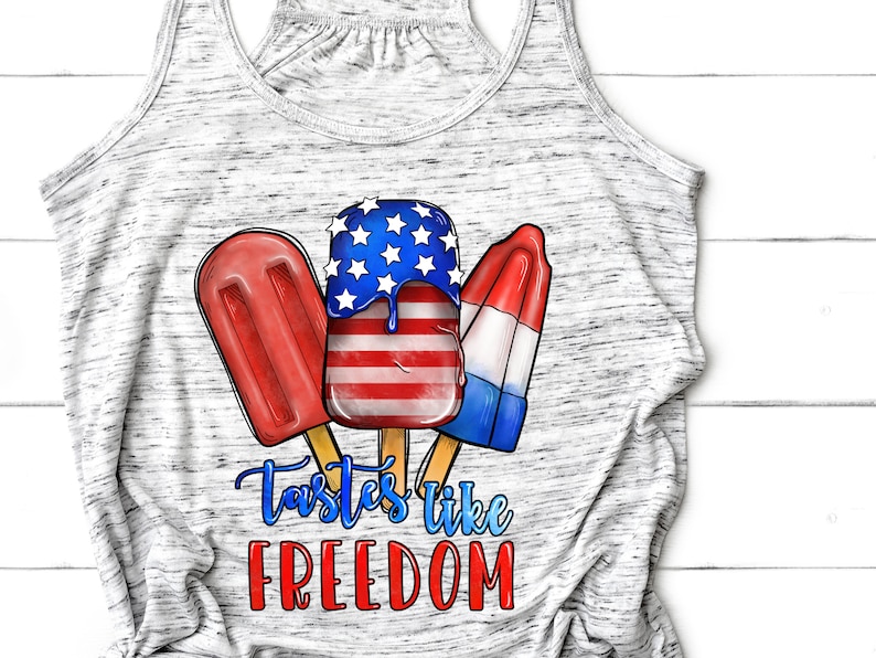 May include: A gray tank top with a graphic of three popsicles. The popsicles are red, white, and blue, and the text "Tastes like FREEDOM" is printed below them.