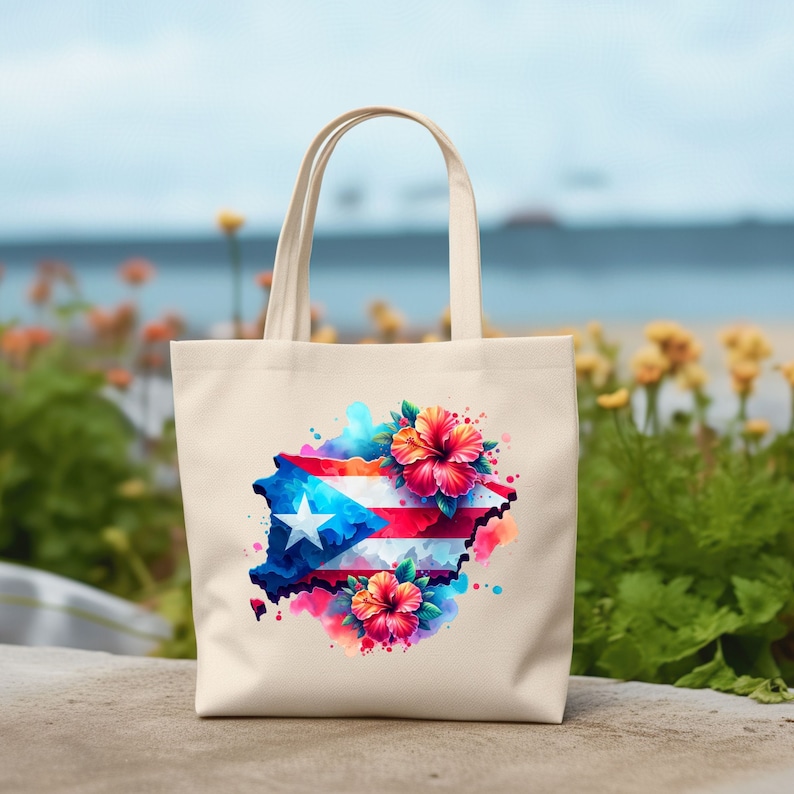 May include: A white canvas tote bag with a colorful watercolor design of the Puerto Rican flag and hibiscus flowers.