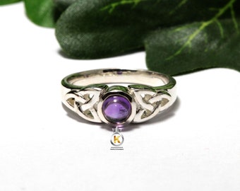 May include: A silver ring featuring a Celtic knot design and a purple amethyst gemstone.