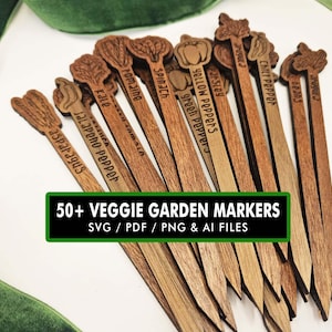 May include: A collection of wooden garden markers, each labelled with a vegetable name such as spinach and peppers. The markers are arranged in a fan shape. The image includes the text "50+ Veggie Garden Markers".