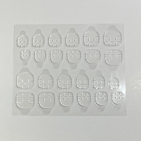 Double-sided adhesive nail tabs