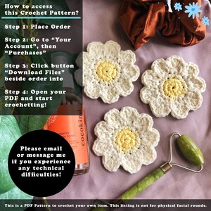 May include: Three handmade crochet daisy coasters with cream petals and yellow centres are shown on a purple surface. The image includes text about accessing the crochet pattern and a jade roller.