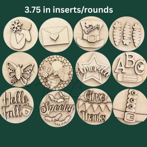 May include: A collection of twelve wooden round inserts, each 3.75 inches in diameter, featuring various designs. Designs include a mitten, envelope, leprechaun hat, carrots, butterfly, bee, star, ABCs, pencil, fall, bats, and a belt.