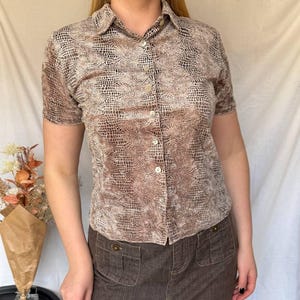 May include: A distressed wooden sign, reading "Welcome to our home" in white lettering. The sign has a rustic finish, ideal for adding a welcoming touch to any home's entrance.