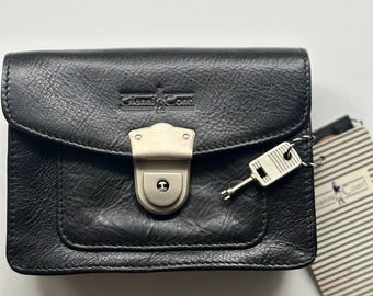 May include: Black leather wallet with a silver lock and key. The wallet has a small pocket on the front and the brand name "Giovanni Conti" embossed on the front.