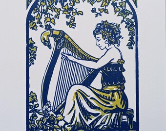 May include: A block print illustration titled La harpiste featuring a person playing a harp under an arched trellis of ivy leaves. The artwork uses blue and yellow ink on white paper, with a red square stamp and a small embossed logo at the bottom.