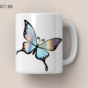 May include: White ceramic mug with a black and iridescent butterfly design. The butterfly has a blue, green, and purple iridescent sheen.