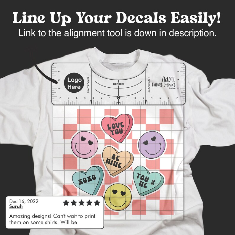 May include: A white t-shirt with a grid pattern and five iron-on decals. The decals are heart-shaped and feature various phrases like "Love You", "Be Mine", "XOXO", and "You & Me". The t-shirt also has a ruler with the words "Adult Pocket T-Shirt" and "Logo Here".
