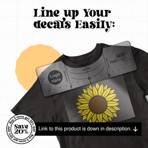 May include: A black t-shirt with a sunflower graphic and a clear plastic ruler with the words "Adult Pocket T-Shirt" and "Logo Here".