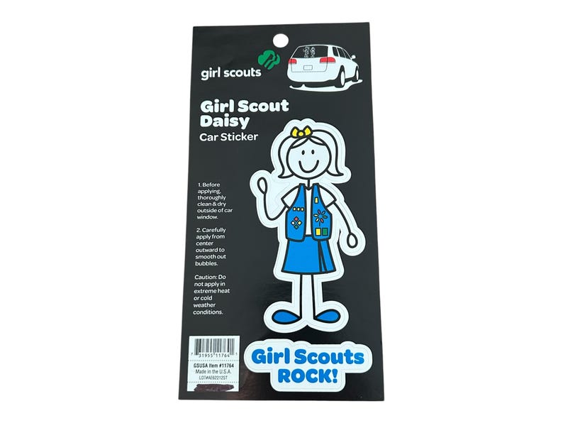 May include: A white car sticker featuring a stick figure of a Girl Scout Daisy in her uniform. The sticker has the text "Girl Scout Daisy Car Sticker" and "Girl Scouts ROCK!"