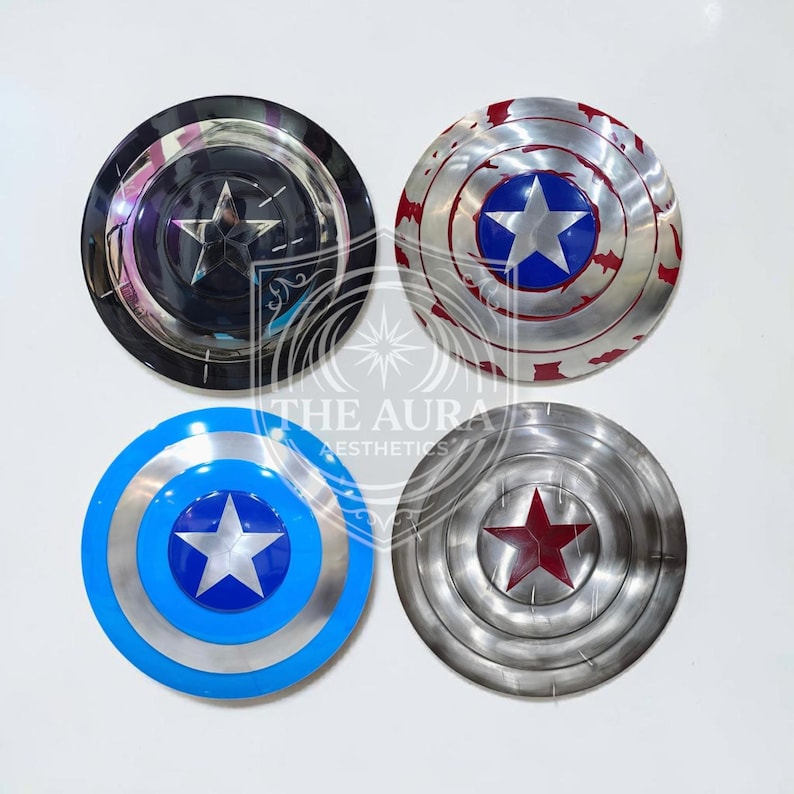 May include: Four metal shields with star emblems. One is black with a silver star, another is silver with a blue star and red accents, a third is blue with a silver star, and the last is silver with a red star.
