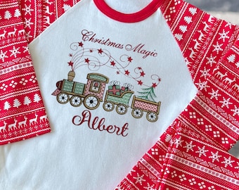 Personalised Childrens Christmas Pyjamas and Sleepsuits. Embroidered Christmas Magic Train Design. A Perfect Christmas Gift