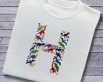 Personalised Embroidered Children's Dinosaur Top. Colourful Dinosaur's Make Up the Letter of the Alphabet. A Perfect Gift for Dinosaur Fans.