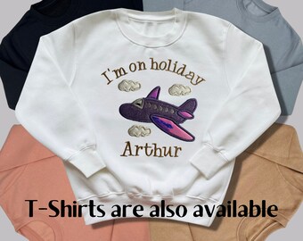 Personalised Embroidered Children's Holiday Top. Wording and Colours Can be Changed to Your Preference. Glittery Aeroplane with Shiny Wings.
