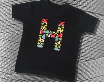 Personalised Embroidered Children's Top. Colourful Cars Trains and Planes Make Up the Letter. A Perfect Gift for Kids who Love Vehicles.
