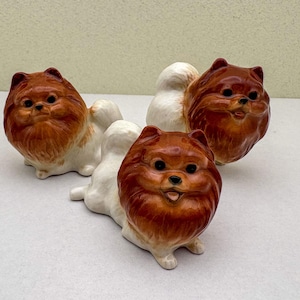 Reddish-Brown Ceramic Pomeranian Figurine Set – Hand-Painted Mini Dog Sculptures, Perfect Gift for Dog Lovers and Collectors.