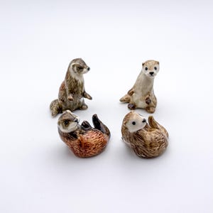 Hand-Painted Ceramic Otter Figurines: Miniature Wildlife Decor
