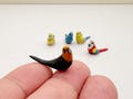 Handcrafted Ceramic Budgie Figurine: Miniature Bird Collectible product logo