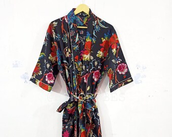 May include: A black floral print robe with a white trim and a matching tie belt.