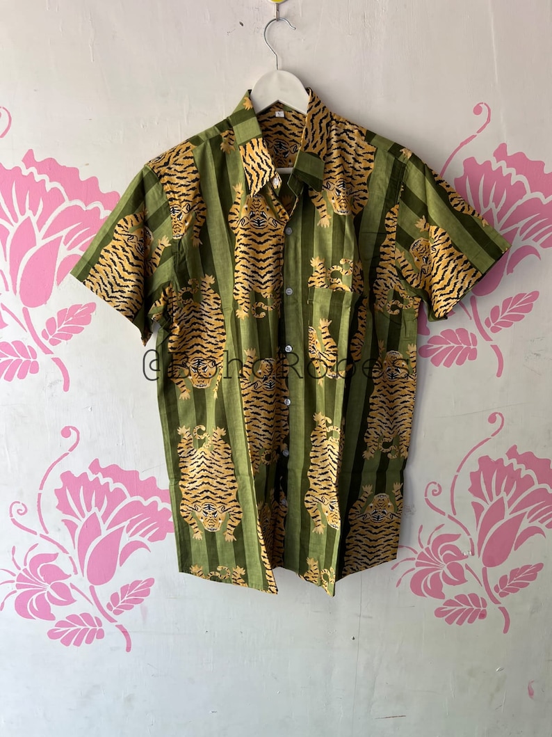 May include: A green and yellow striped short-sleeved button-up shirt with a tiger print.