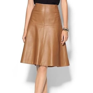 May include: A brown leather A-line skirt with a high waist and a flared hem.