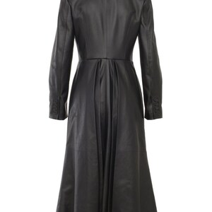 May include: A long black leather coat with a fitted bodice and a flared skirt. The coat has a double-breasted closure and a high collar.