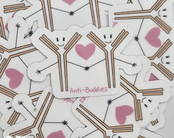 May include: A collection of white stickers featuring cartoon-like antibody figures with smiling faces, arms outstretched, and a pink heart in the center. The text "Anti-Buddies" is printed on the stickers.