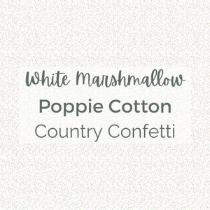 May include: Image features the text "White Marshmallow Poppie Cotton Country Confetti" in a dark gray font, set against a speckled white background. The text is arranged in three lines, with each word clearly visible.