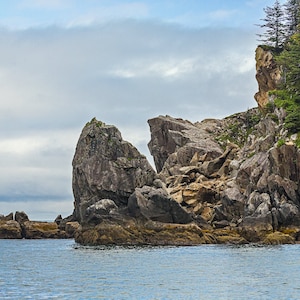 Rocks jutting into the blue ocean near Seward, Alaska landscape wall art in Canvas, Print, or Framed