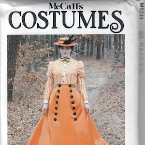 May include: A vintage-inspired women's costume pattern for a long skirt and blouse. The pattern features a striped blouse with a bow tie and a long orange skirt with a button-up front. The model is wearing a hat with a feather.