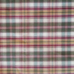 May include: A plaid fabric with a pattern of red, green, brown, and white stripes.