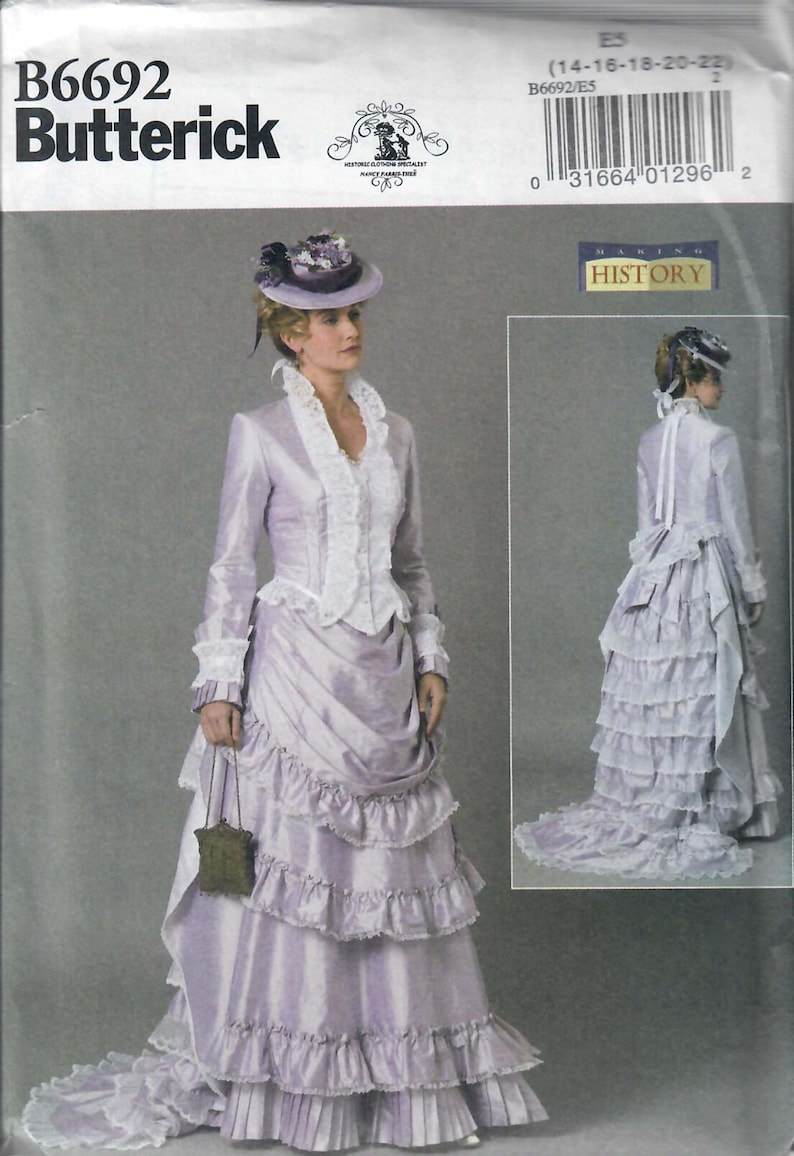 May include: A vintage sewing pattern for a long, lilac-colored dress with a lace trim and a ruffled skirt. The pattern is from Butterick and is for sizes 14-16-18-20-22. The pattern is titled "Making History".