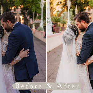May include: A bride and groom kiss on a walkway with a white railing and lush greenery in the background. The bride is wearing a white wedding dress with a long veil and the groom is wearing a dark blue suit.