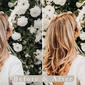 May include: A side view of a person with long, wavy, light brown hair standing in front of a wall of white flowers. The person is wearing a white, sleeveless top.