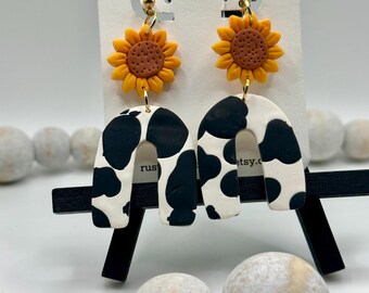 cow print earrings, cow and sunflower, arch earrings, sunflower earrings, clay earrings, scalloped earrings