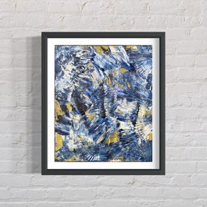 May include: Abstract painting in a black frame. The painting features a blue and gold colour scheme with brushstrokes creating a swirling, dynamic pattern.