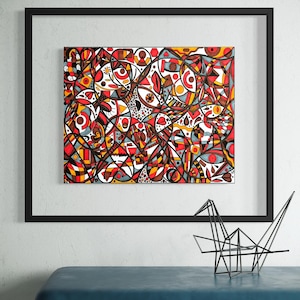 May include: A framed abstract artwork featuring a complex composition of interlocking geometric shapes, curved lines, and circular motifs in a vibrant palette of red, orange, yellow, black, and white, displayed in a thin black rectangular frame.