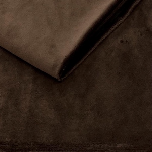 Puede incluir: Primer plano de una tela de felpa marrón. La tela tiene una textura suave y peluda.