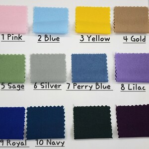 May include: Swatch card with ten fabric samples in different colors. The colors are pink, blue, yellow, gold, sage, silver, perry blue, lilac, royal blue, and navy blue. The colors are labeled with numbers 1 through 10.