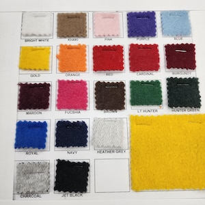 May include: A color chart of fabric swatches in various colors, including bright white, khaki, pink, purple, blue, gold, orange, red, cardinal, burgundy, maroon, fuchsia, brown, light hunter, hunter green, royal, navy, heather grey, charcoal, and jet black.