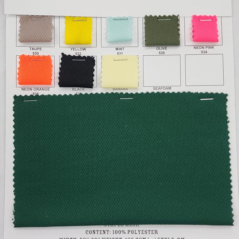 May include: A swatch card displaying 10 fabric samples in various colours. The colours are: taupe, yellow, mint, olive, neon pink, neon orange, black, banana, seafoam, and a dark green. The fabric is a mesh material. The text on the card reads: "CONTENT: 100% POLYESTER"