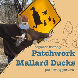 May include: A person wearing a brown sweatshirt with a mallard duck design, holding a yellow road sign with a duck silhouette. The sign reads "Patchwork Mallard Ducks" and "beginner friendly" with a "pdf sewing pattern" description.